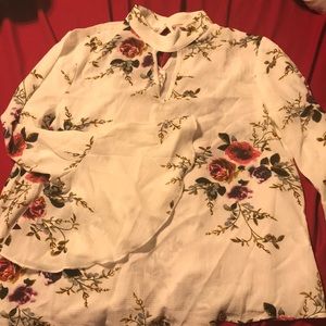 A floral blouse with bell flared arms